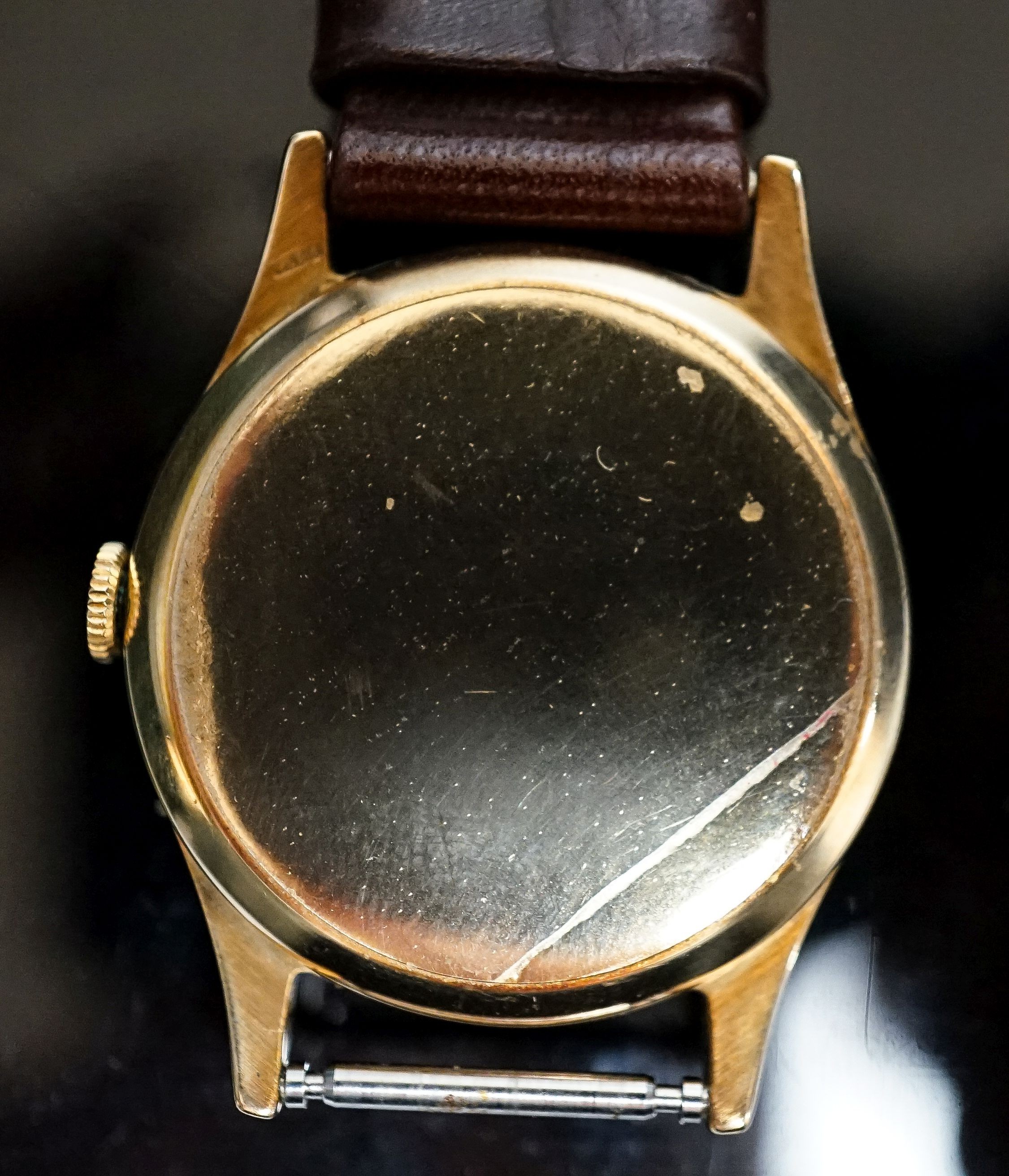 A gentleman's late 1950's 9ct gold Rolex Precision, manual wind wrist watch, on associated leather strap, with box and purchase receipt dated 3/8/1959, cased diameter 31mm, gross weight 28.5 grams, part of strap detached